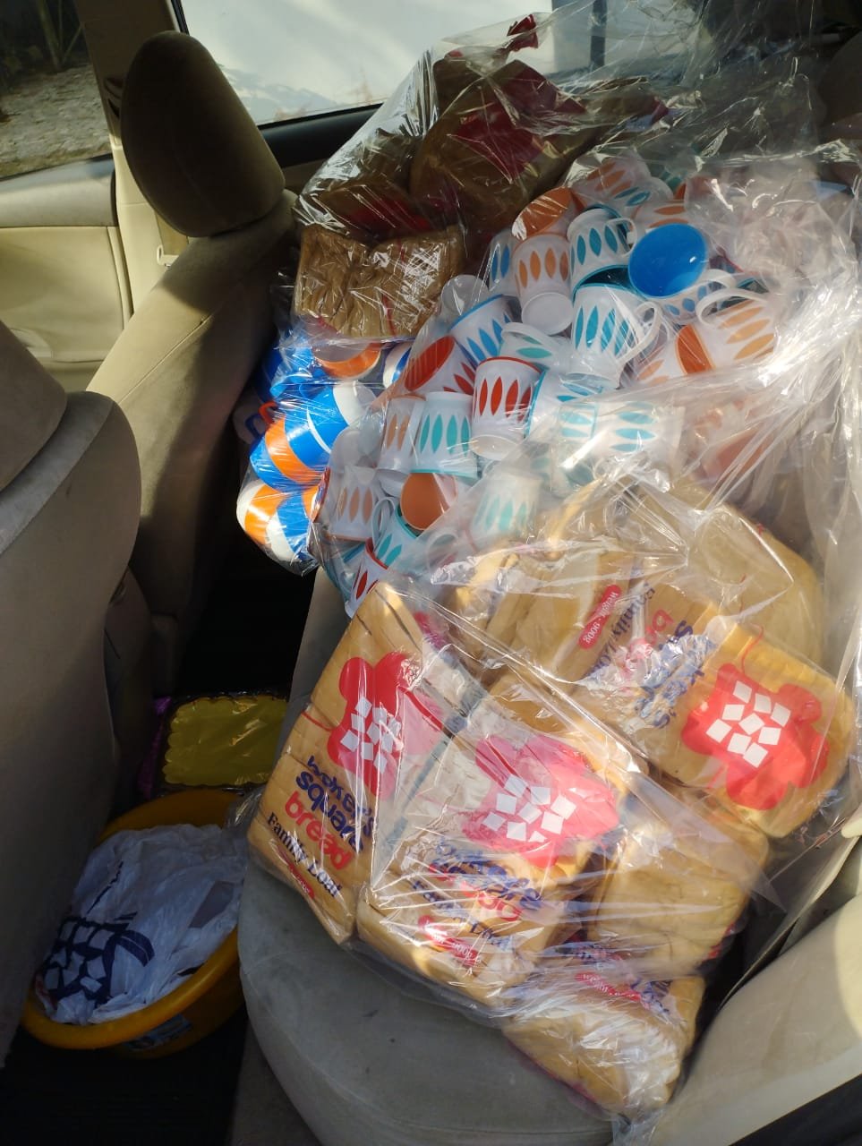 Bread and cups packed for food distribution